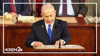 Netanyahu received a standing ovation on the house floor while protestors were outside burning effig