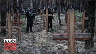 Ukraine examines bodies from mass graves discovered after regaining territory from Russia
