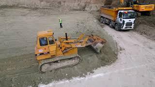 Awesome Cat 955L Tracked Loader is pushing soil