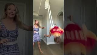 Mom pushes her daughter off swing