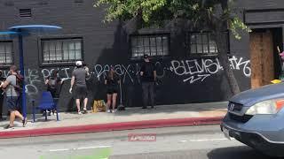 Many volunteers remove grafitti from Santa Monica wall 6120