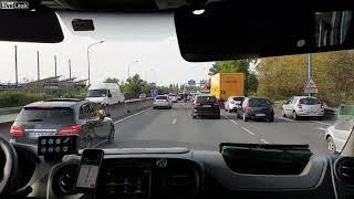 Good biker escorts ambulance during traffic