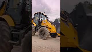 The New JCB Backhoe Loader Moving Material