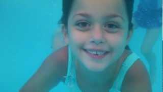 Cute young girls swimming