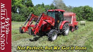 Baling Hay  The Square baler still isnt working very good.  So we finished by making Round bales