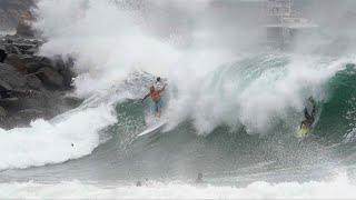 Surfer gets caught in big wave chaos