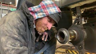 The thread puzzle struggle Stub axle nut tight headlamp change Volvo car mobile truck mechanic.
