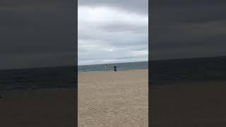 Playing football alone Venice Beach  32220