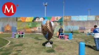 Pintan murales sobre muro fronterizo en Tijuana