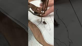 Cutting custom ukulele sound holes