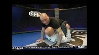 Rogan demonstrating taking the back with Bas Rutten