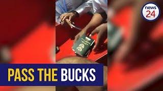 WATCH OR Tambo Airport security accept cash bribe