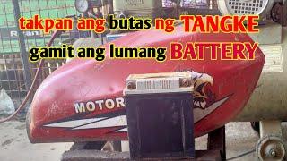 takpan ang butas ng tangke gamit ang lumang battery