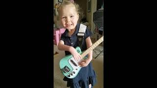 Four-year-old TRYING her first guitar