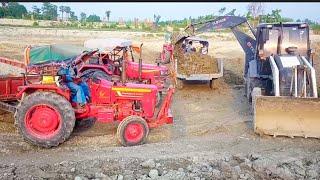 #video - Terex backhoe loading soil in tractors trolleys