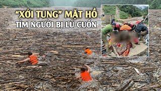 Công an xới tung mặt hồ ken đặc củi rác tìm người bị lũ cuốn