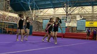 Young gymnasts enrolled in low-cost program show off their skills