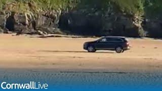 Speeding Audi races across busy Cornwall beach