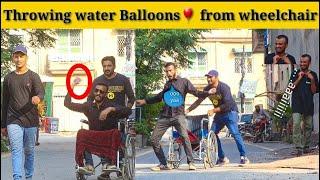 Throwing Water Balloons from wheelchair  Water Balloon prank @Laughtertvpranks