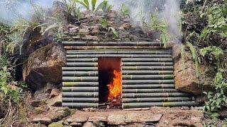 Building complete & warm survival shelter  Bushcraft stone hut grass roof and fireplace