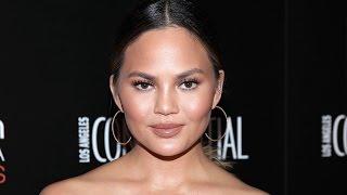 Chrissy Teigen Suffers Nip Slip at Super Bowl and Her Reaction is Everything