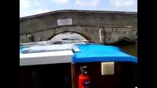Potter Heigham bridge pilot takes our boat under the bridge Norfolk Broads 2012