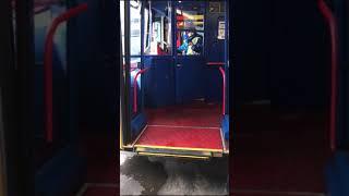 In the cab of a Ex-Edinburgh bus tours bus and putting the ramp down