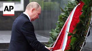 Russias Putin lays wreaths at two Hanoi monuments during Vietnam state visit