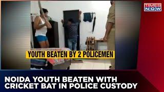 Shocking Video From Noida Goes Viral Two Policemen Mercilessly Beat Youth With Cricket Bat