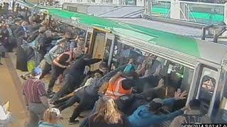 Mind the gap Commuters push train to save trapped man in Perth