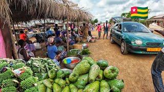 Rural market day in Assahoun village . Cheapest mass food market in Togo west Africa 