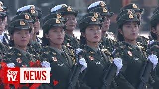 15 military units march in Chinas largest National Day parade