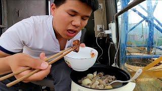 Tower crane drivers working meal eating pigs trotters at a height of 70 meters