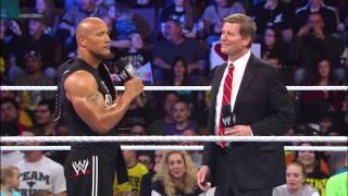 The Rock takes down People Power delivering a Peoples Elbow to a returning John Laurinaitis Smack