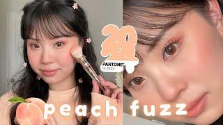 A PEACH FUZZ MAKEUP LOOK  pantone colour of 2024