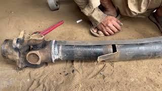 the middle point of drive shaft is totally broken in two points mechanic repair it universal joint -