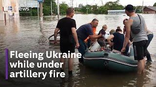 Civilians fired at while fleeing Nova Kakhovka dam floods in Ukraine