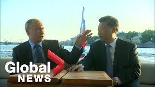 Vladimir Putin Xi Jinping take a leisurely boat tour together