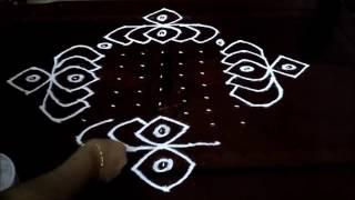 Simple lotus flowers  kolam with 15-1 straight  chukkala muggulu with dots rangoli design