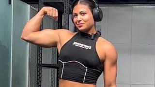 Beautiful brazilian muscle girl flexing muscles