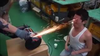 Crazy Asian Washes His face  With Flying Sparks From Metal Cutter Machine