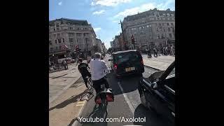 Cyclist rides toward a pedestrian who is crossing almost hitting then tries to blame the pedestrian