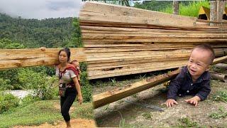 Single mothers use their savings to buy materials to build houses process and transport wood.