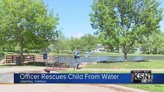 Topeka officer rescues child from pond