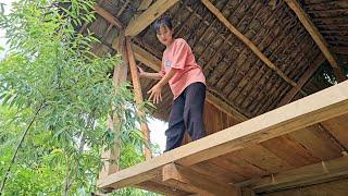 How a girl assembles wooden house wallsDragon eye island