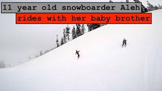 11 year old girl snowboarder Aleh rides with her 5 year old baby brother