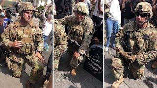 US National Guard members take the knee with protesters after Keke Palmer speech