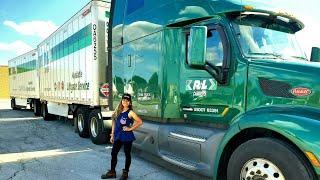 FilipinaFemale Truck Driver Connecting Double Trailers