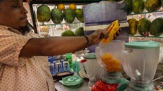 Papaya Juice  Fresh and Delicious Street Drinks Papaya Juice  Young Man Selling Street Food