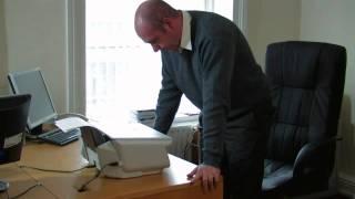 Angry Irish man rips a printer apart with his bare hands. Awesome